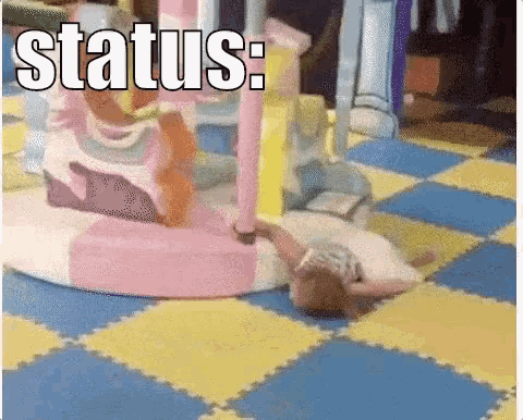 GIF of a little girl laying on the floor in a playground being dragged by the merry go round indicating her level of exhaustion, and referencing my burn out